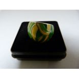 A Silver Ring decorated with green and yellow Enamel. Measuring 16.8mm across the top Size - N (