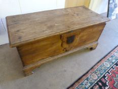 An antique pine trunk with original fittings
