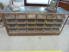 A 24 drawer Haberdashery counter on oak frame - crack on glass to front