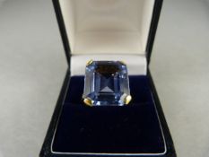 A 9ct yellow Gold ring set with an approx 16mm x 13.6mm emerald cut Aquamarine. Size N(UK) 6.5(USA)