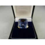 A 9ct yellow Gold ring set with an approx 16mm x 13.6mm emerald cut Aquamarine. Size N(UK) 6.5(USA)