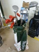 A Macgregor golf bag containing Wilson Irons, 2 -9 pitcher sand wedge putter, and Petron Woods 13