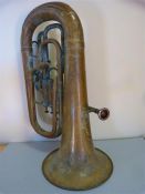 A Brass Euphonium with three fitted valves - stamped number 30662 by Hawkes & Son - some dents