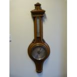 A Banjo barometer - highly decorated (possibly fruitwood or oak)