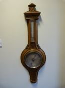 A Banjo barometer - highly decorated (possibly fruitwood or oak)