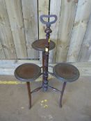 An Edwardian Mahogany three tier plant stand