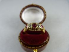 An 18ct Gold Victorian style ring set with 3 Rubies and 2 bright old cut Diamonds approx 3.2mm