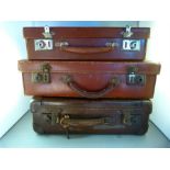 Three small vintage suitcases