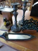 Two plated ornate candle sticks, cast iron letter holder etc