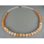 Graduated coral necklace with silver clasp