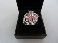 A Silver Ring Set with four Teardrop Pink CZ's and 4 small white CZ's, overall diameter 17.65mm Size