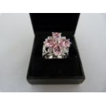 A Silver Ring Set with four Teardrop Pink CZ's and 4 small white CZ's, overall diameter 17.65mm Size