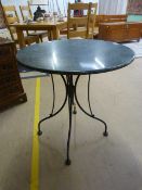 A Cast iron coffee table with marble top
