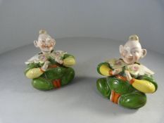 A pair of oriental style seated nodding figures - 1 A/F