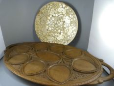 A heavily carved wooden serving tray, Paper Mache plate and a pair of plaster wall sconces