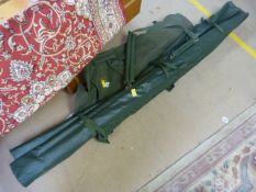 A Large rod Holdall with umbrella etc