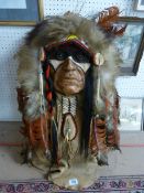 A Native American Headdress with Red dyed eagle feathers - The Hide possibly buffalo or