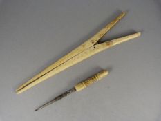 A pair of Ivory Glove stretchers and an Ivory Pin hook