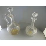 A cut glass decanter and a claret decanter