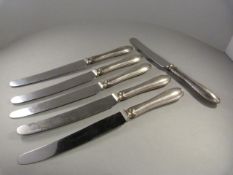 A Set of six silver handled knives