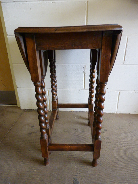 A small oak dropleaf table on Barley Twist legs