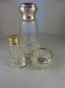 A hallmarked silver top glass perfume bottle David Loebl 1921, a small trinket glass pot with