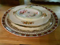 A Large red and yellow platter, two others and a Royal Albert dish