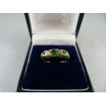 A 9ct Yellow Gold victorian style ringset with three Emeralds and two small Diamond Size M(UK) 6(