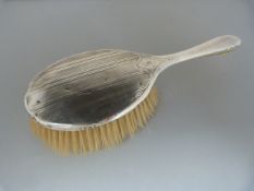 A Birmingham 1911 Hallmarked silver dressing table brush