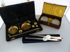 A Boxed pair of glass and silverplate salts, small jewellery weighing scales and silverplated