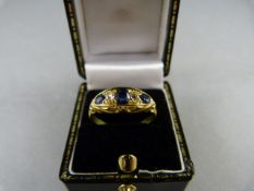 An 18ct Gold Diamond and Sapphire Ring - Size P