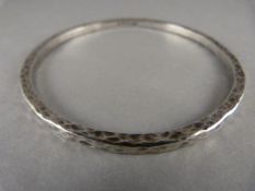 A hallmarked silver bangle - assayed Birmingham, makers mark Ivor Gordon Ltd 21.6g