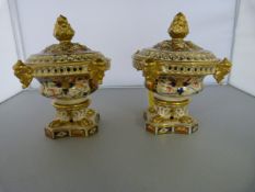 A Pair of Bloor Derby Imari coloured circular Pastille Burners. Highly decorated sitting on lions