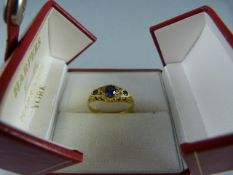 An 18ct yellow gold (Chester HM) set with three blue stones (sapphires?) - 1 blue stone damaged