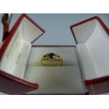 An 18ct yellow gold (Chester HM) set with three blue stones (sapphires?) - 1 blue stone damaged