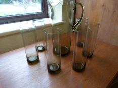 A Smokey glass lemonade jug and 6 matching glasses