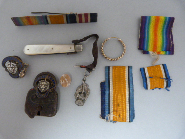 A collection of items to include, penknife, ribbons and some silver etc