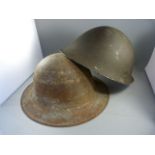 Two tin military helmets