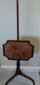 A Mahogany pole screen