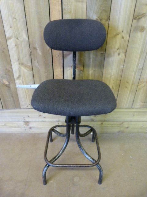 An industrial workers stool, the upholstery redone