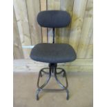 An industrial workers stool, the upholstery redone