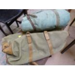 A vintage army camp bed with bag