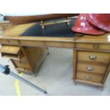 Twin pedestal leather topped light wood partners style desk. Tambour rollers one side and drawers