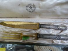 A Boxed Serving knife and Fork with continental marked handles - 800..