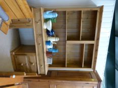 A Pine pedestal desk with bookcase over