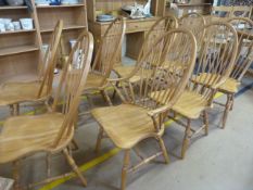 A Set of eight stick back chairs to include two carvers