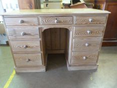 A Large pine kneehole desk