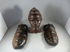 A Pair of Carved African Masks and a Terracotta Bust of a Tribal man signed to back