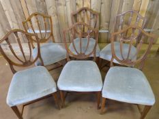 A set of six mahogany framed dining room chairs with blue upholstered seats