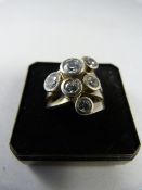 Silver contemporary ring set with six CZ stones. Size K UK, 5 1/8 USA